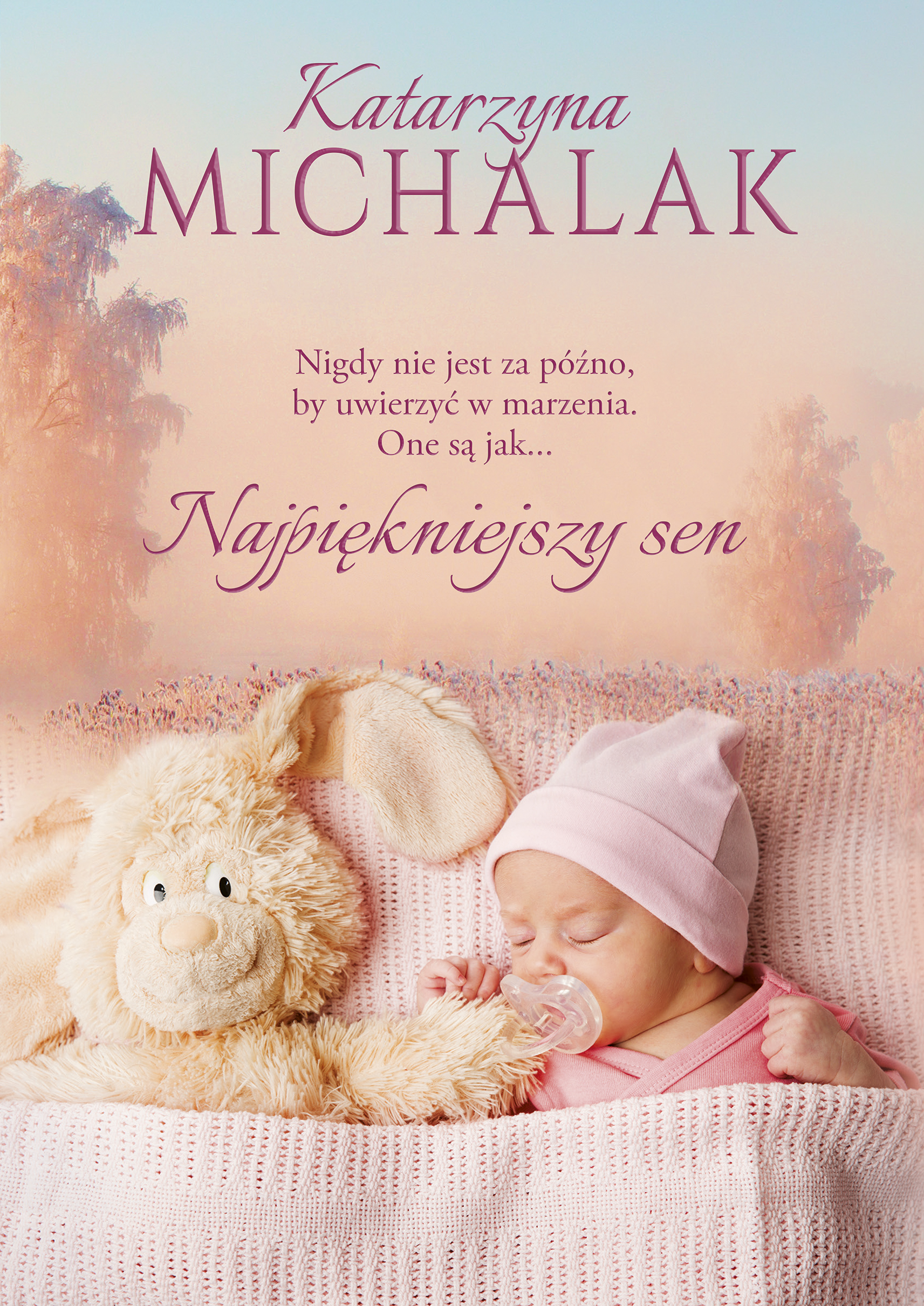 Na okładce śpiące niemowlę w różowej czapeczce i ubranku, z różowym smoczkiem. Obok leży pluszowy kremowy króliczek.